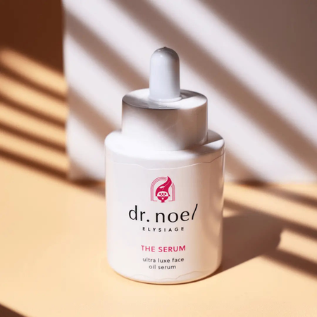 Dr. Noel The Serum – Anti-Aging Serum for Smooth, Refined Skin in a white dropper bottle with pink logo, ideal for sensitive and mature skin care.